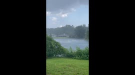 Sudden heavy rain and fierce winds by the lake in Jacksonville, Florida