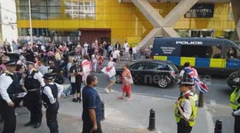 Anti-migrant demonstrators confront the police as tensions flare up and scuffles break out at the protest outside the Britannia Hotel Canary Wharf where asylum seekers are being housed