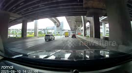 Delivery truck skids on road but lands safely in adjacent lane