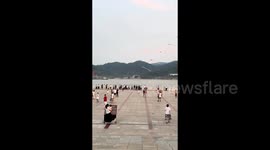 Man, 72, rides balance scooter while flying 130-metre-long kite