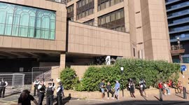A cyclist shows his anger towards the police outside the Britannia Hotel, whilst a protest against the Illegal Immigrants being in the hotel takes place