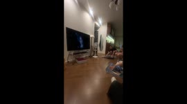 Cat skids on floor and walks back near owner in Guangdong, China
