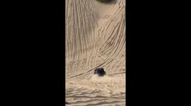 Off-road vehicle conquers steep sandy hill in Liaoning, China