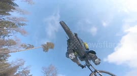 Insane POV: Mountain Biker Flies Over Skier in Winter Wonderland