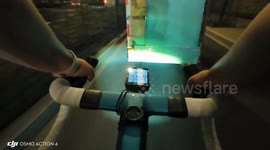 Cyclist loses balance and crashes while wiping face in Zhejiang, China