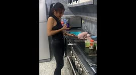 Friend massages meat before cooking in Guayana, Venezuela