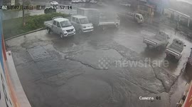 White vehicle skids, crashes into mini truck and falls into water in Hunan, China