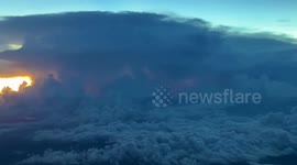 Lightning flashes behind thick clouds in USA