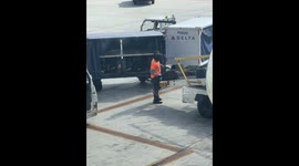 Delta Baggage Handler Throwing Bags