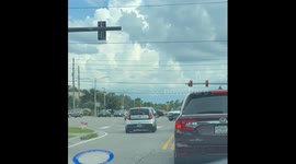 Driver Pulls Into Oncoming Lane at Intersection