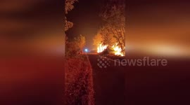 Spain: Nighttime Wildfire Lights Up Rural Road As Flames Threaten Retorta