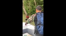Lost fisherman rescued after holding onto tree to survive in flood