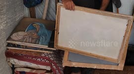 Gaza artist burns his own paintings for survival amid blockade