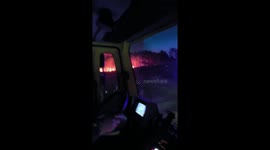 Wildfires blaze through forest fanned by heatwave and strong winds in Muxía, Spain