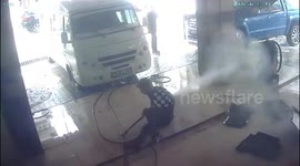 Man struggles with pressure pump after slipping at car wash in Mersin, Erdemli