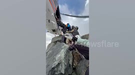 Helicopter rescues stricken climber from near-vertical 14,500ft summit