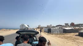 Palestinians scramble for air-dropped aid amid Gaza famine