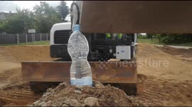 Unbelievable Skill: Excavator Opens Bottle with Bucket!