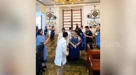 Wedding through flooded church during typhoon in the Philippines