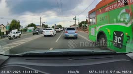 Utility pole snagged by passing bus crashes onto car, driver miraculously unharmed