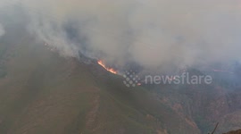 High temperatures ease as Spain battles 21 wildfires