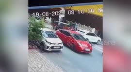 Driver crashes new car into parked vehicle in bizarre reversing fail