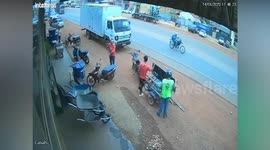 Dad slips as son runs into road and misses lorry by inches