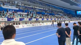 Automaton runs over to race referees at robot Olympics in China
