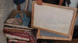 Gaza artist burns his own paintings for survival amid blockade