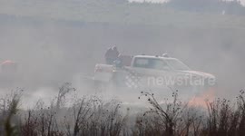 Teams fight to control fast-spreading fire in Italy