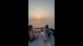 Jet ski splashes boaters on the sea in Dubai, UAE