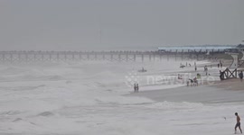 US: Surfers drawn to high waves as Hurricane Erin hits Wrightsville Beach in US