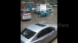 Driverless tricycle suddenly crashes into car before returning to spot in spooky scene