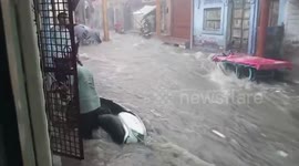 Flash floods wash away motorcycles amid heavy rain in India