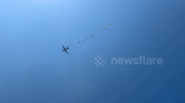 Hunger-stricken Palestinians rush for airdropped aid in central Gaza amid Israeli blockade