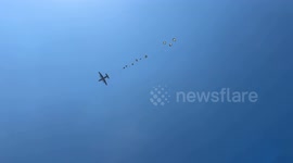 Hunger-stricken Palestinians rush for airdropped aid in central Gaza amid Israeli blockade