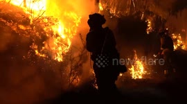 Firefighting brigades battle raging wildfire overnight in Spain's Galicia