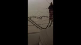 Wholesome moment: Woman expresses her love in the snow during the first snowfall of 2024