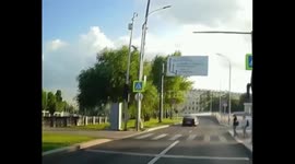 Biker hit by car while letting pedestrians pass in Moscow, Russia