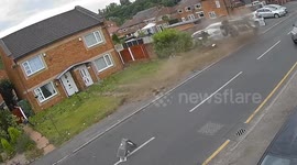 Shocking moment driver flips before smashing into lamppost and parked cars