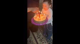 Little boy blows birthday candle in Almaty, Kazakhstan