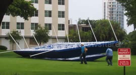 US: Strong Winds Blow Off Pool Deck Canopy in Southern Florida