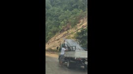 Landslide crashes onto road in front of shocked drivers
