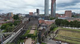 Deansgate viaduct skywalk and sprawling skyline turning into the monopolis that is Manchester