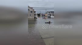 US: Kayak Navigates Flooded Streets As Hurricane Erin Slams Avalon