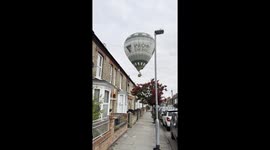 HOT AIR SCARE: HOT AIR BALLOON TOUCHES DOWN ON RESIDENTIAL ROAD