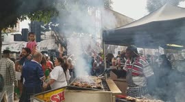 Crowds enjoying the celebrations and street food at the Notting Hill Carnival 2025
