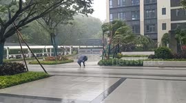 Typhoon Kajiki slams China seeing locals struggle to walk in gale-force winds