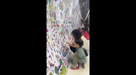 Commuters can doodle on subway station tunnel while they wait for train