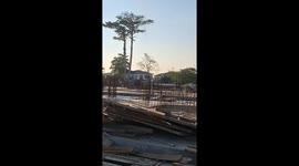 Stunned workers watch as dust devil tornado rips through hospital construction site